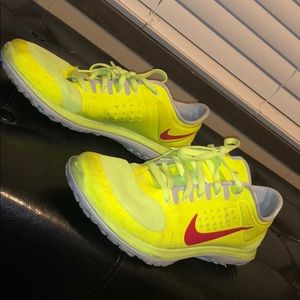 Yellow nike running shoes